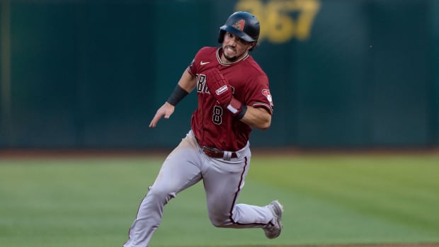 Arizona Diamondbacks outfielder Dominic Fletcher (8) rounds second against the Oakland Athletics at Oakland Coliseum.